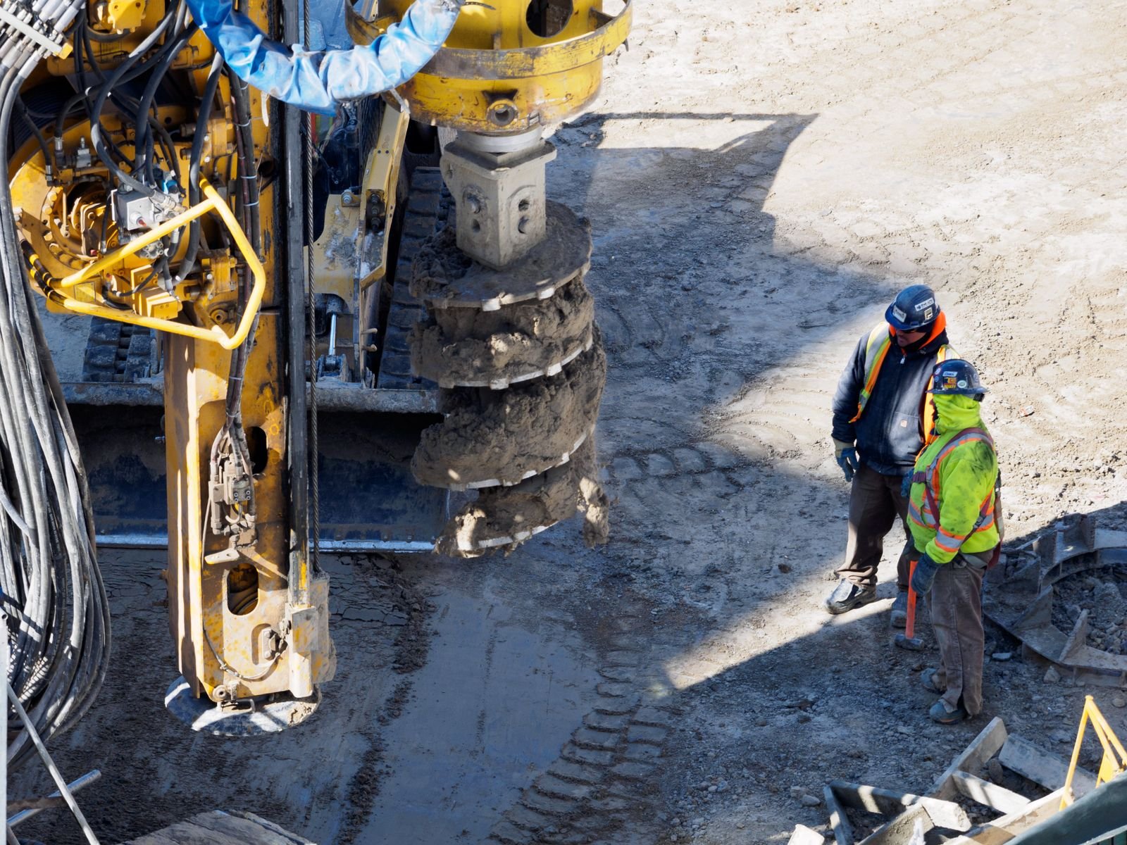 Drilling equipment and site personnel preparing foundation works